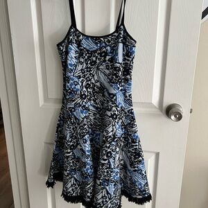 Woman’s Blue and Black Floral Fit-and-Flare Dress Sweater material